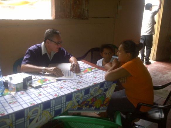 Dr. Juarez, a contracted Nicaraguan doctor, consults with a mother and her child